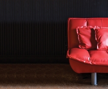 A red couch at The Freight Room, the music venue connected to The Depot Coffee House