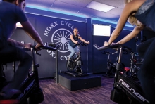 A cycling class at Moxx Cycling in Long Lake.