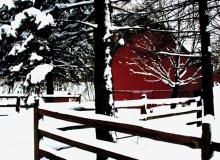 A red barn is surrounded by snow in this Lens on Lake Minnetonka photo contest winning photo.