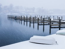 The aftermath of a spring blizzard on a dock on Lake Minnetonka.