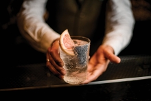 Bartender holding a cocktail