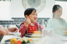 A child enjoys a meal at Taste Fore the Tour.