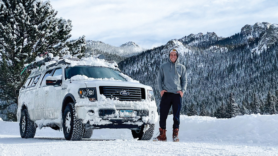 Mavrik Joos in snowy landscape with truck.
