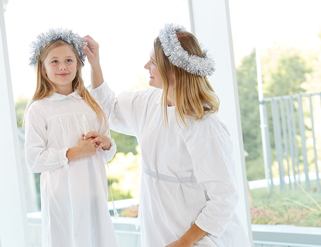 Nora Perkins, who stars in the American Swedish Institute's St. Lucia concert, stands with her mother, Ulrika Perkins