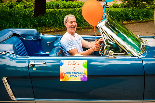 A man celebrates his classic car birthday.