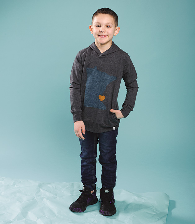 A child models clothing from Oh Baby!