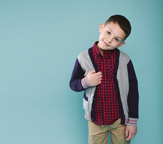 A child models clothing from Oh Baby!