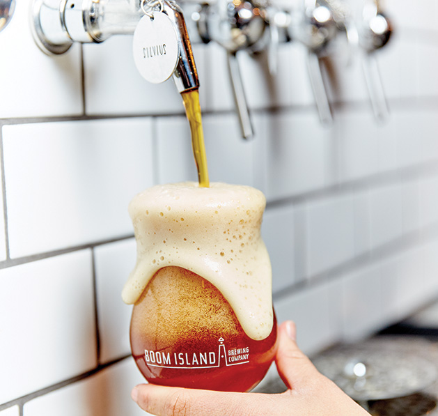 A beertender pours a beer at Boom Island Brewing in Minnetonka