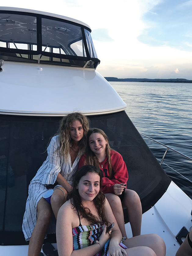 Allyson Fanger with two of her daughters on the lake in Minnesota.