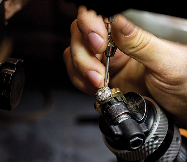 A jewelry designer works on a ring at Veberod Gem Gallery