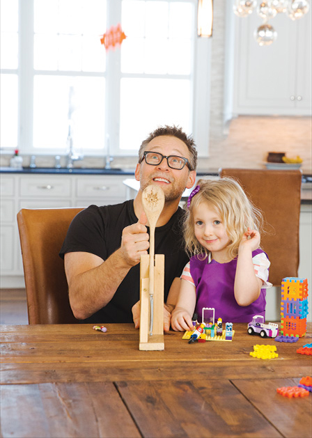 Steve Kuhl plays with his daughter.